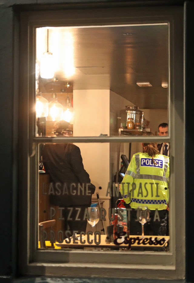 Police inside a Zizzi restaurant in Salisbury which has been closed in connection with an incident in which former Russian double agent Sergei Skripal was left critically ill by exposure to an unknown substance. (Steve Parsons/PA)