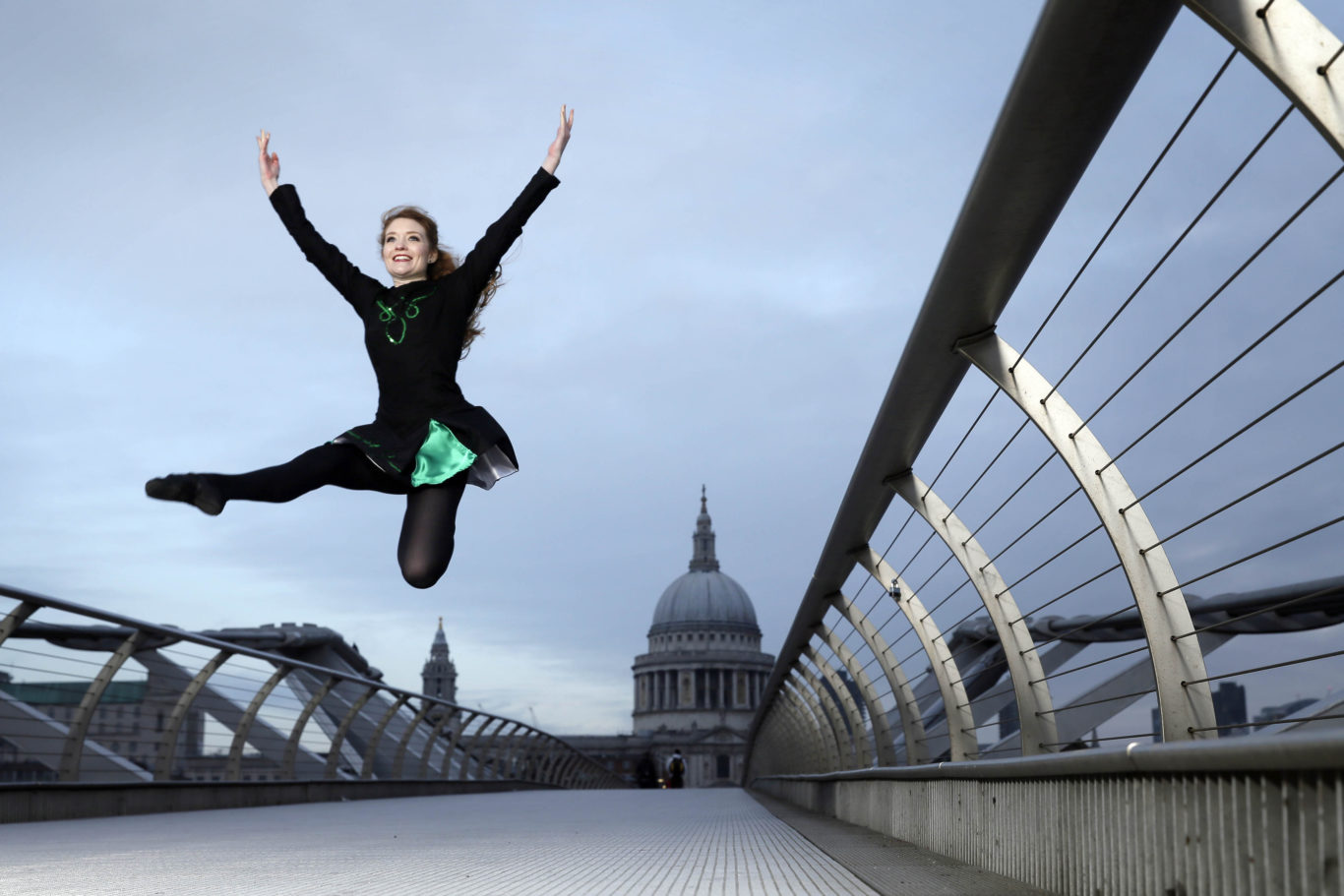 Irish dancers perform on London's Millennium Bridge (Tim Ireland/PA)