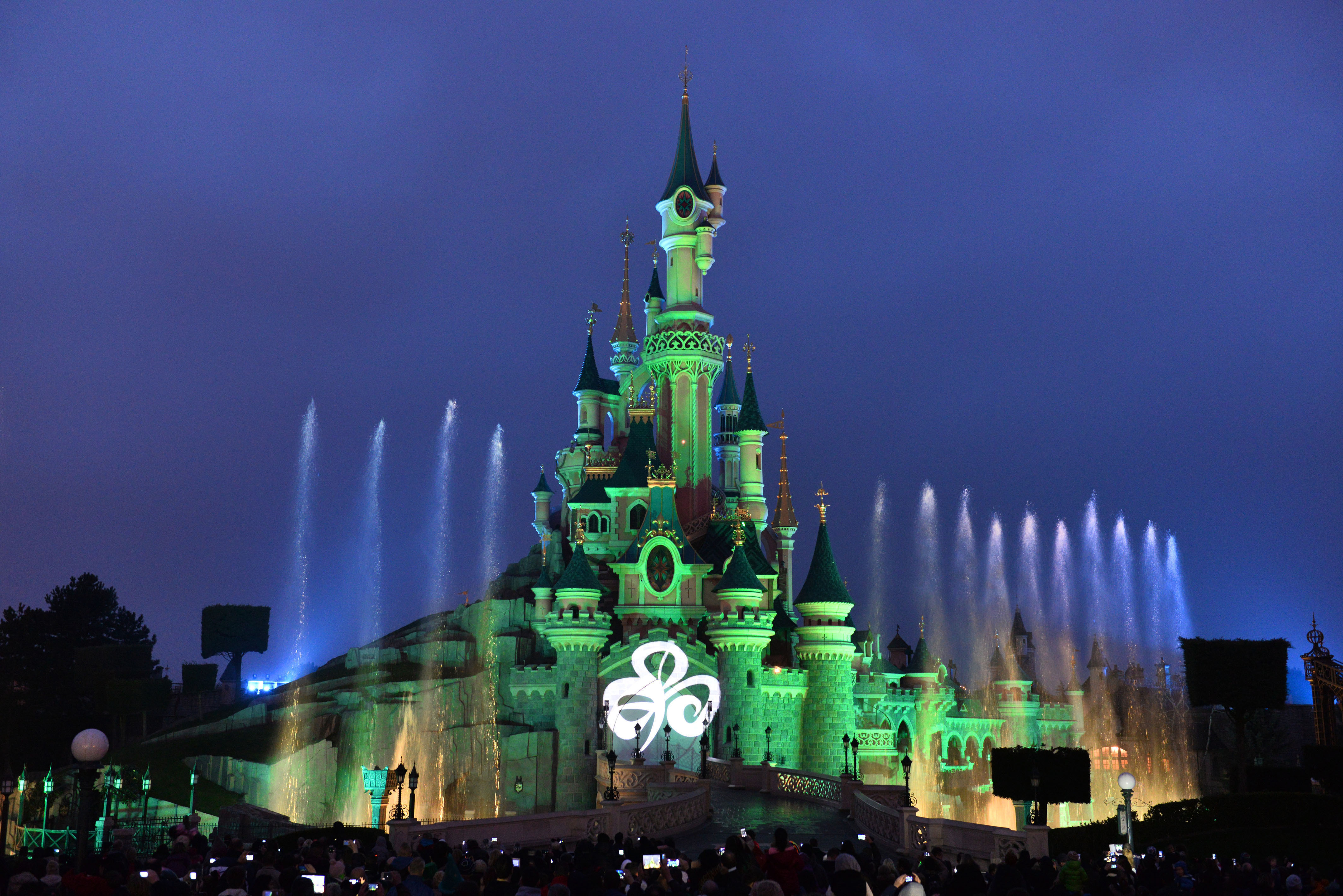 While across the Channel in France, Sleeping Beauty’s Castle at Disneyland Paris also turned green 