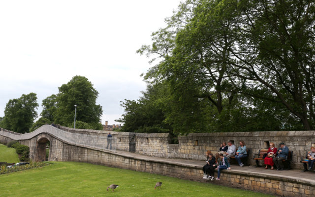 People on the city walls in York (Lynne Cameron/PA)