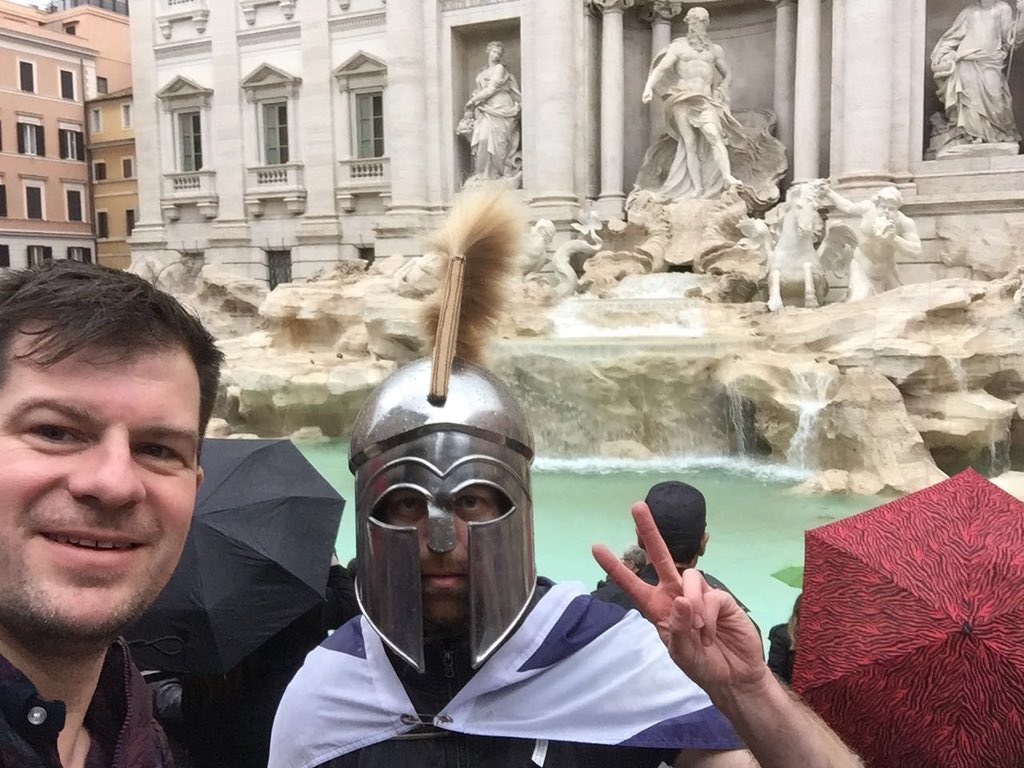 A Scotland fan poses with a helmet he bought in Rome