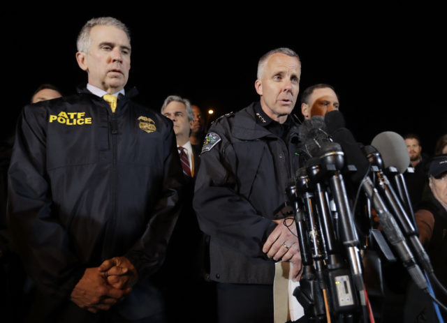 Police chief Brian Manley, right, briefs the media in the Austin suburb of Round Rock (Eric Gay/AP)