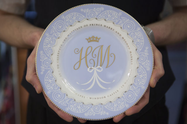 The souvenir plate with the monogram H and M and detail inspired by the wedding venue, displayed in The Queen's Gallery shop attached to Buckingham Palace (Rick Findler/PA)