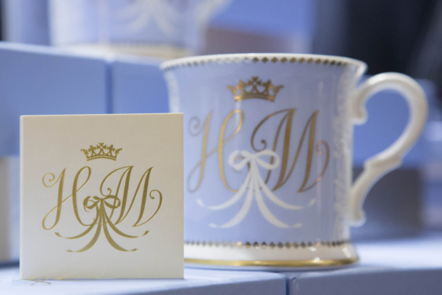 The matching monogram on the card and tankard (Rick Findler/PA)