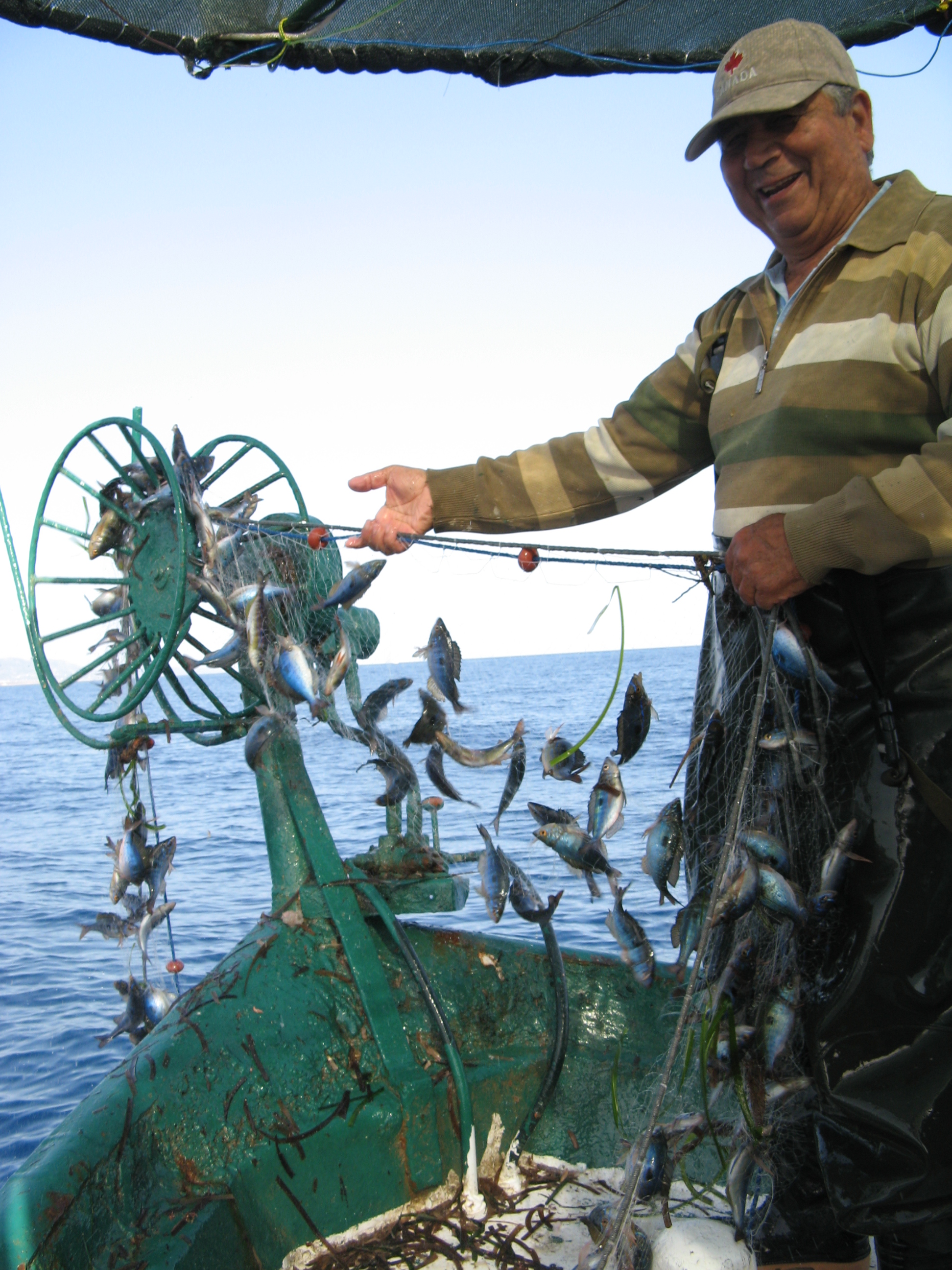 A fisherman off the coast of northern Cyprus with his catch (Robin Snape/University of Exeter/PA).
