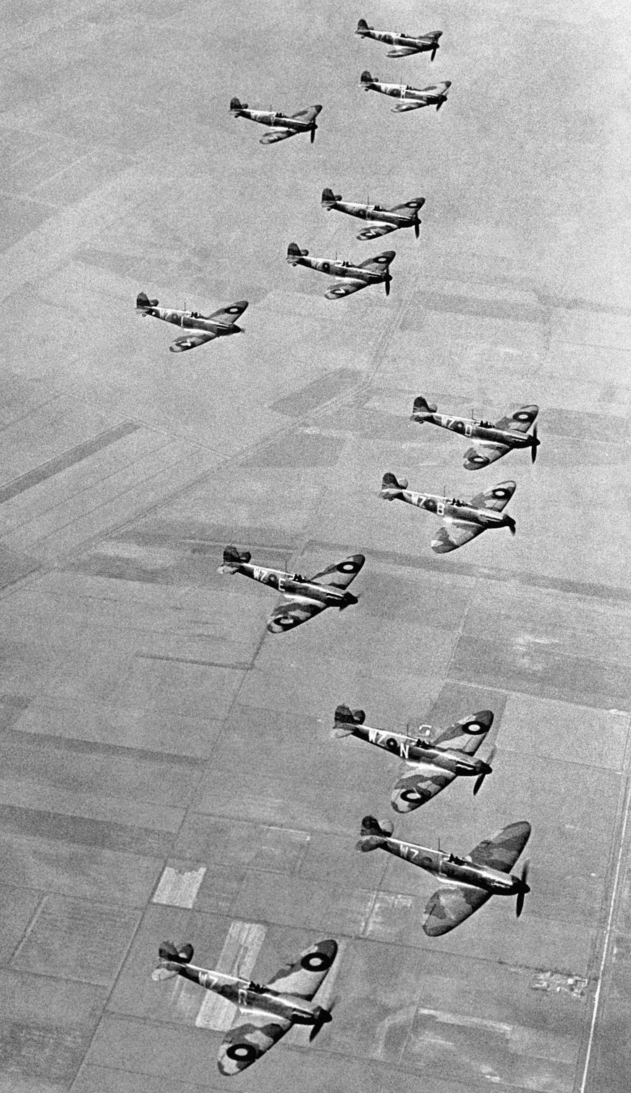 No19 Fighter Squadron, based at Duxford, Cambridgeshire, flying their two blade propeller Supermarine Spitfire aircraft in formation in 1939 (PA)
