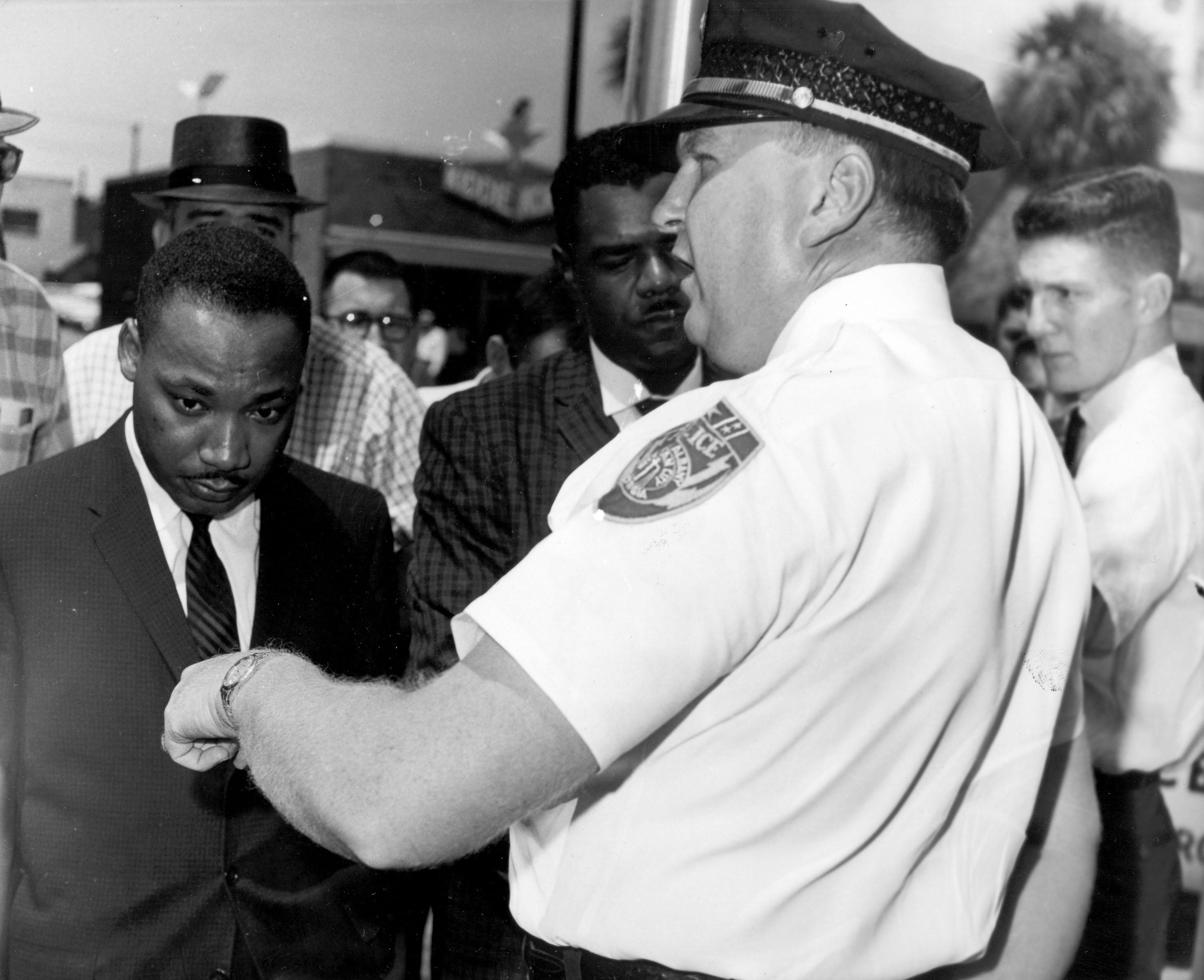 Dr Martin Luther King Jr is arrested by Albany's chief of police after praying at City Hall in Albany (AP)