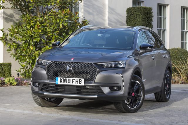 The large front grille is fringed by daytime running lights