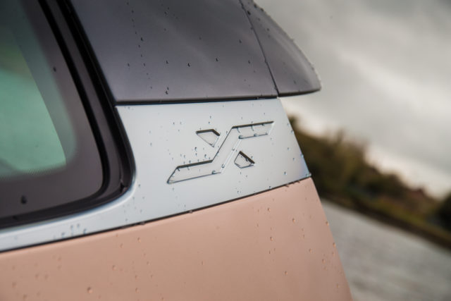 X monikers adorn the sides of the car