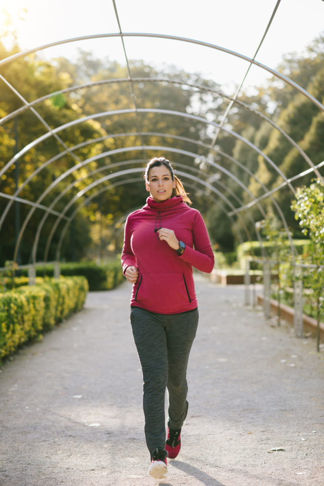 Pregnant woman jogging outdoors