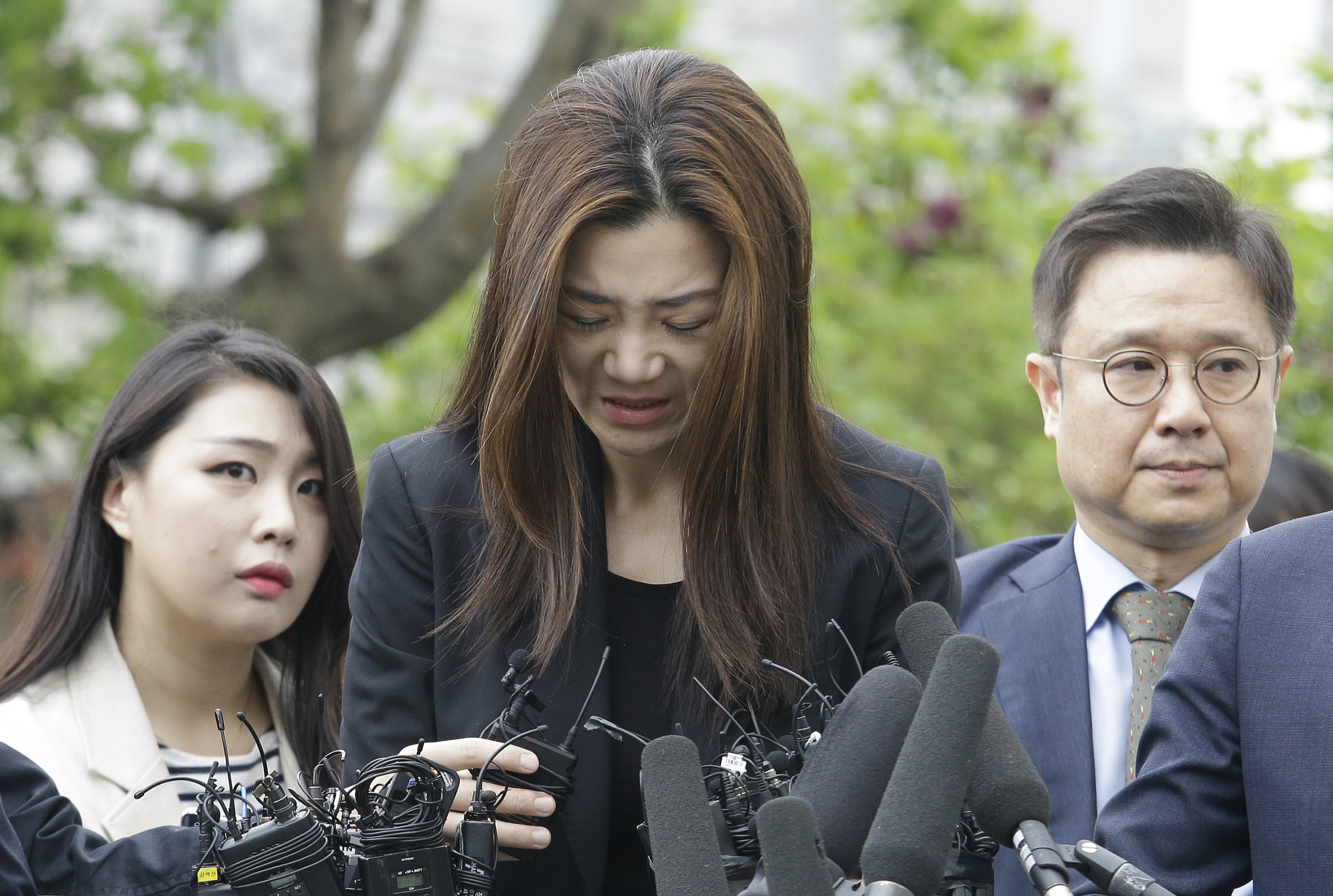 Cho Hyun-min speaks as she arrives at a police station in Seoul (Ahn Young-joon/AP)
