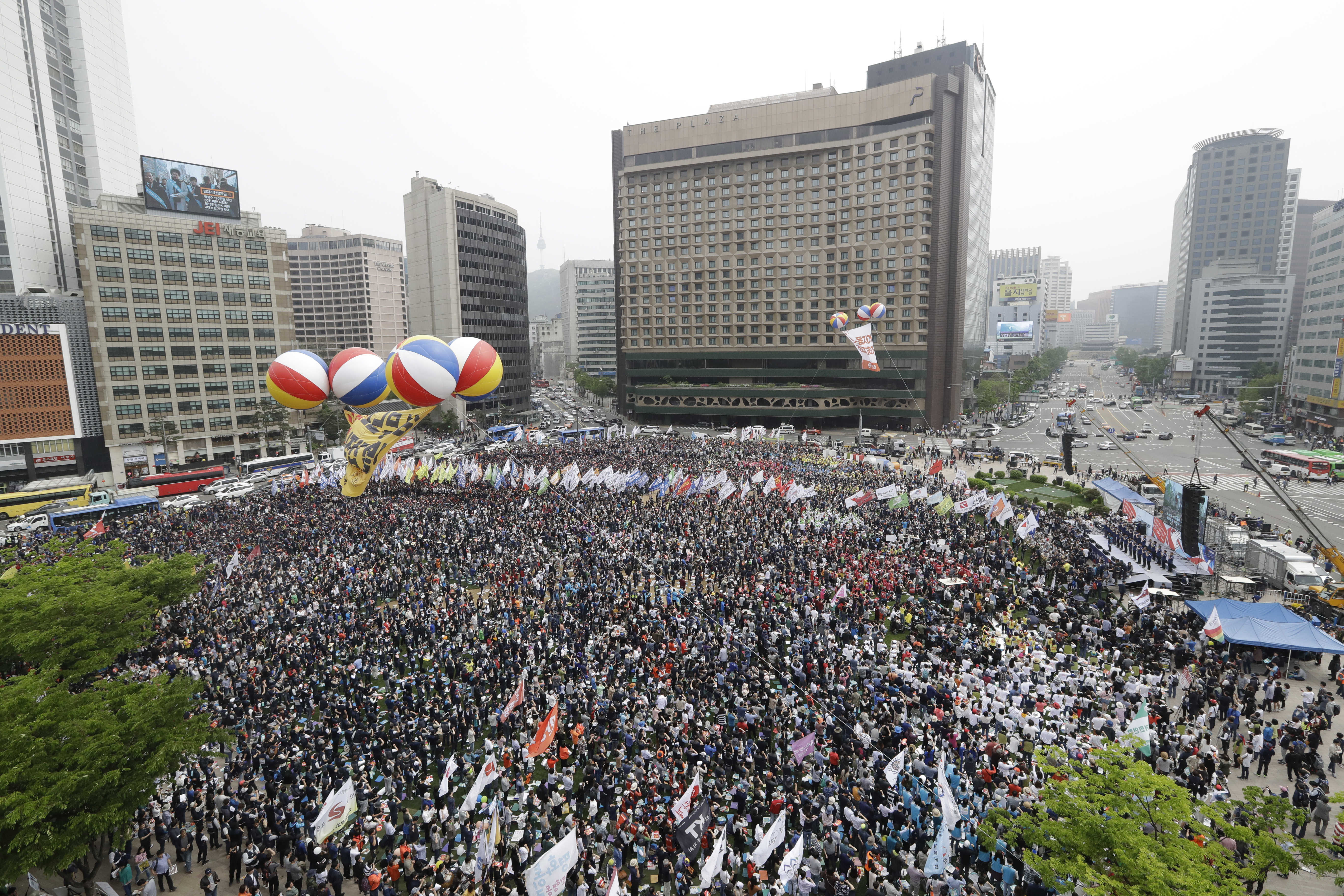 Members of the Korean Confederation of Trade Unions attend a May Day rally in Seoul Plaza (Lee Jin-man/AP)