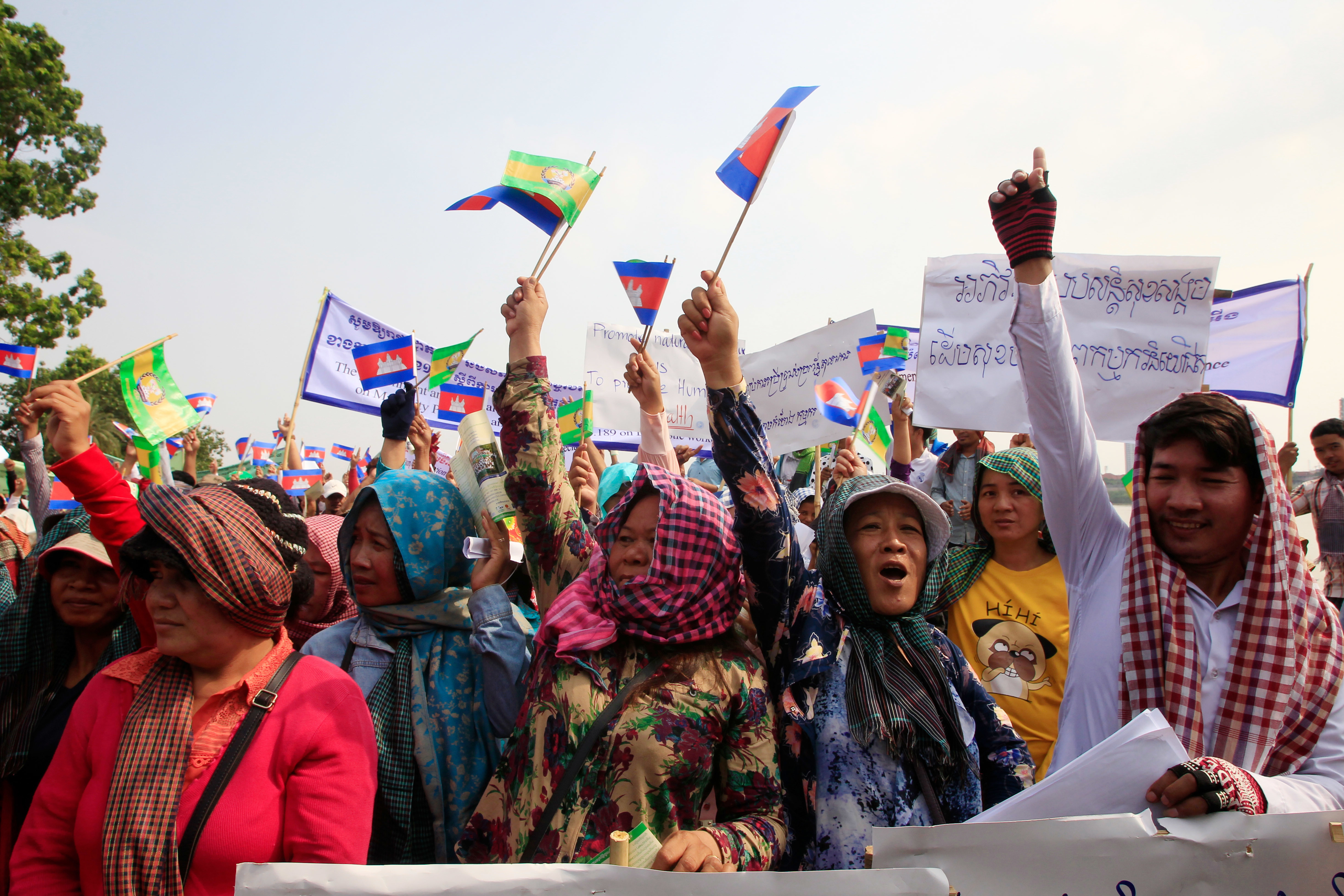 Cambodian workers shout during a gathering to mark May Day at Tonle Sap river bank in Phnom Penh (Heng Sinith/AP)