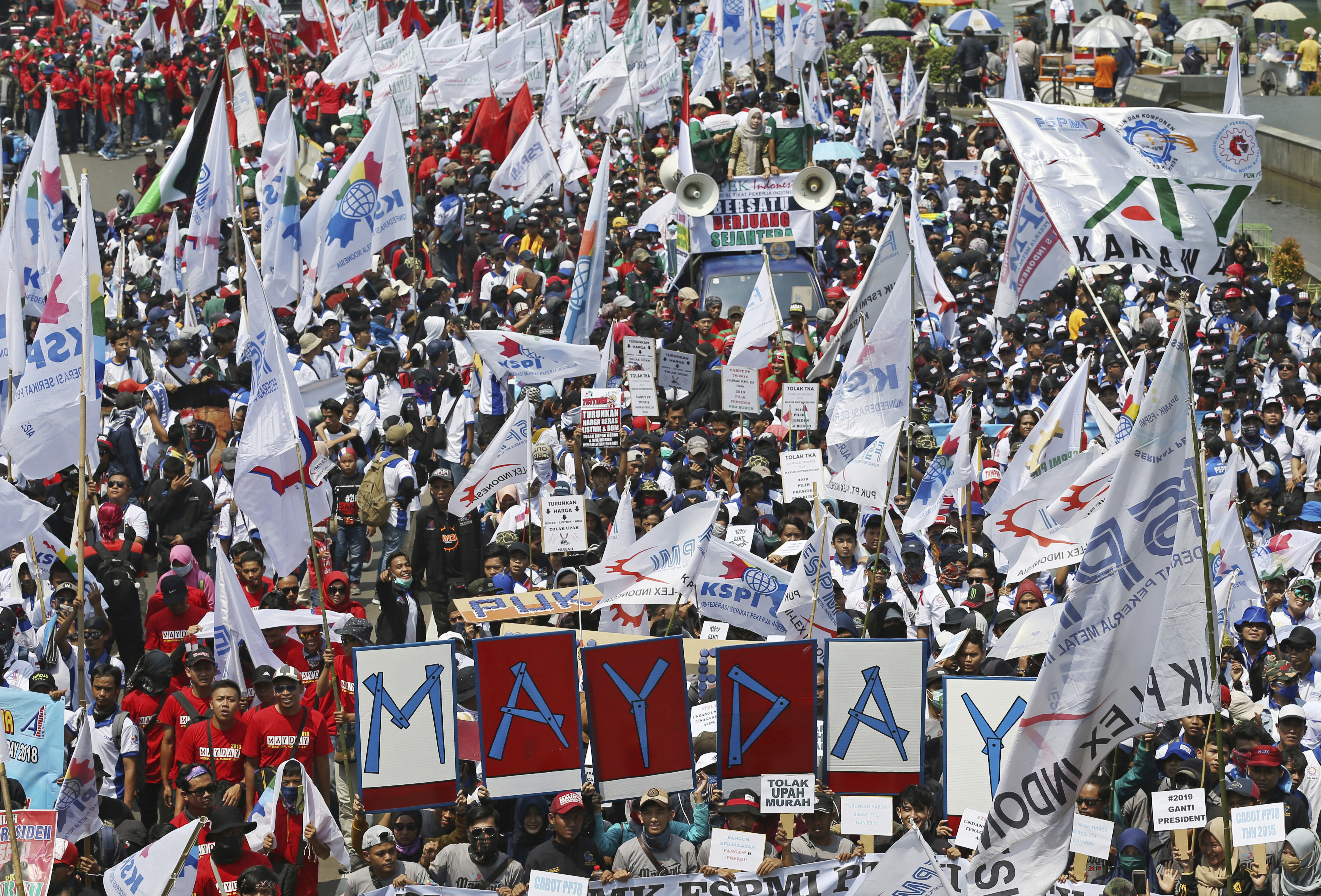 Indonesian workers during a May Day rally in Jakarta (Achmad Ibrahim/AP)