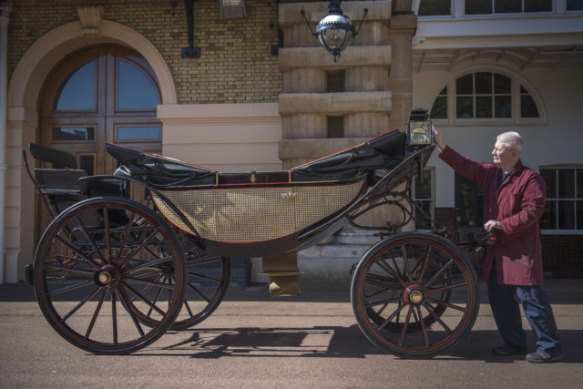 Senior carriage restorer Martin Oates polishes the Ascot Landau which will be used during Prince Harry and Meghan Markle's carriage procession. (Victoria Jones/PA Wire)