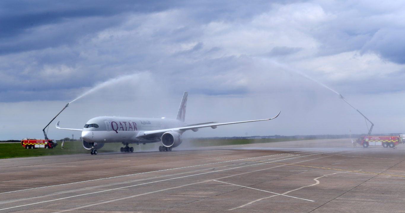 The aircraft is given a water cannon salute (Qatar Airways/PA)