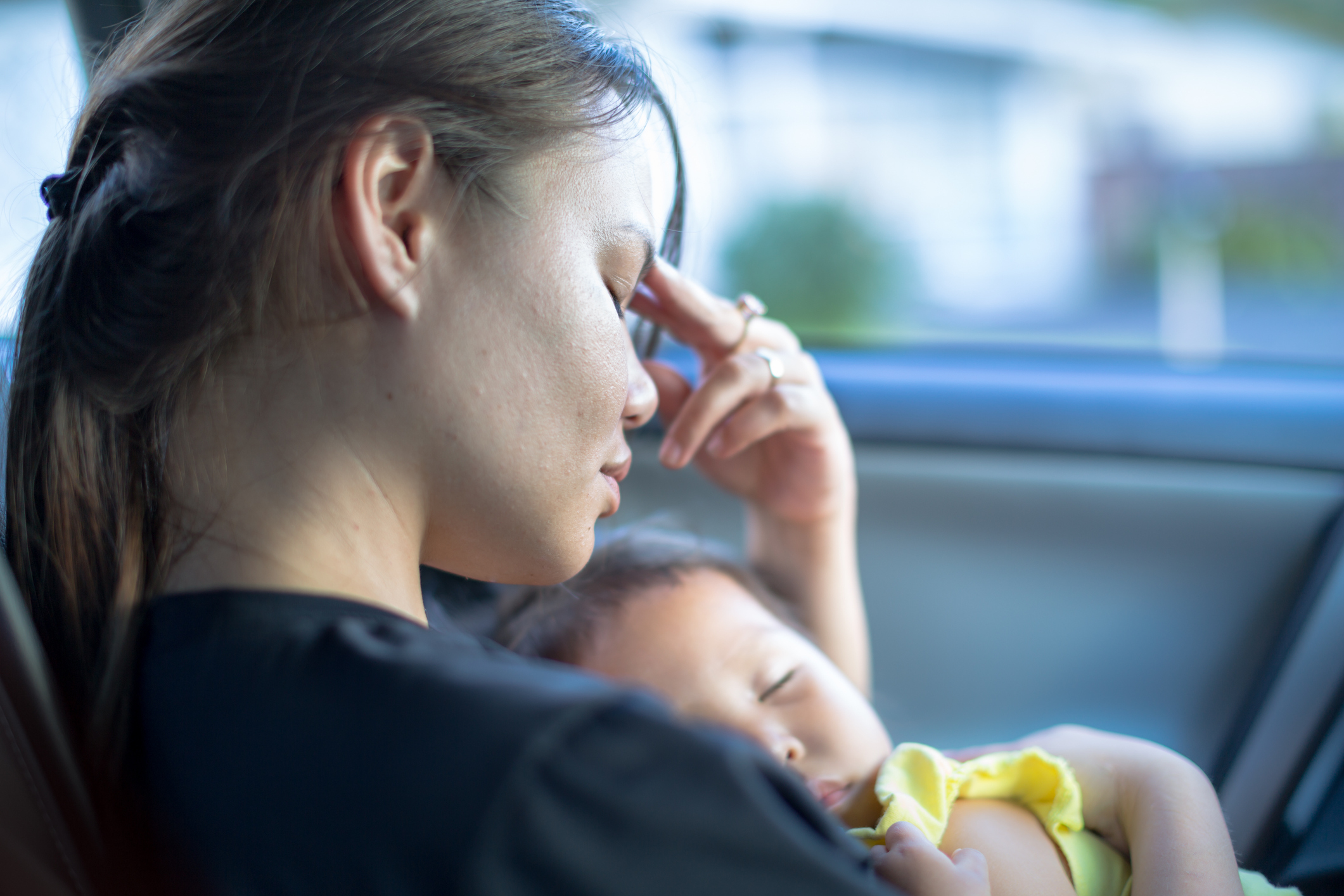 A stressed mother with her baby