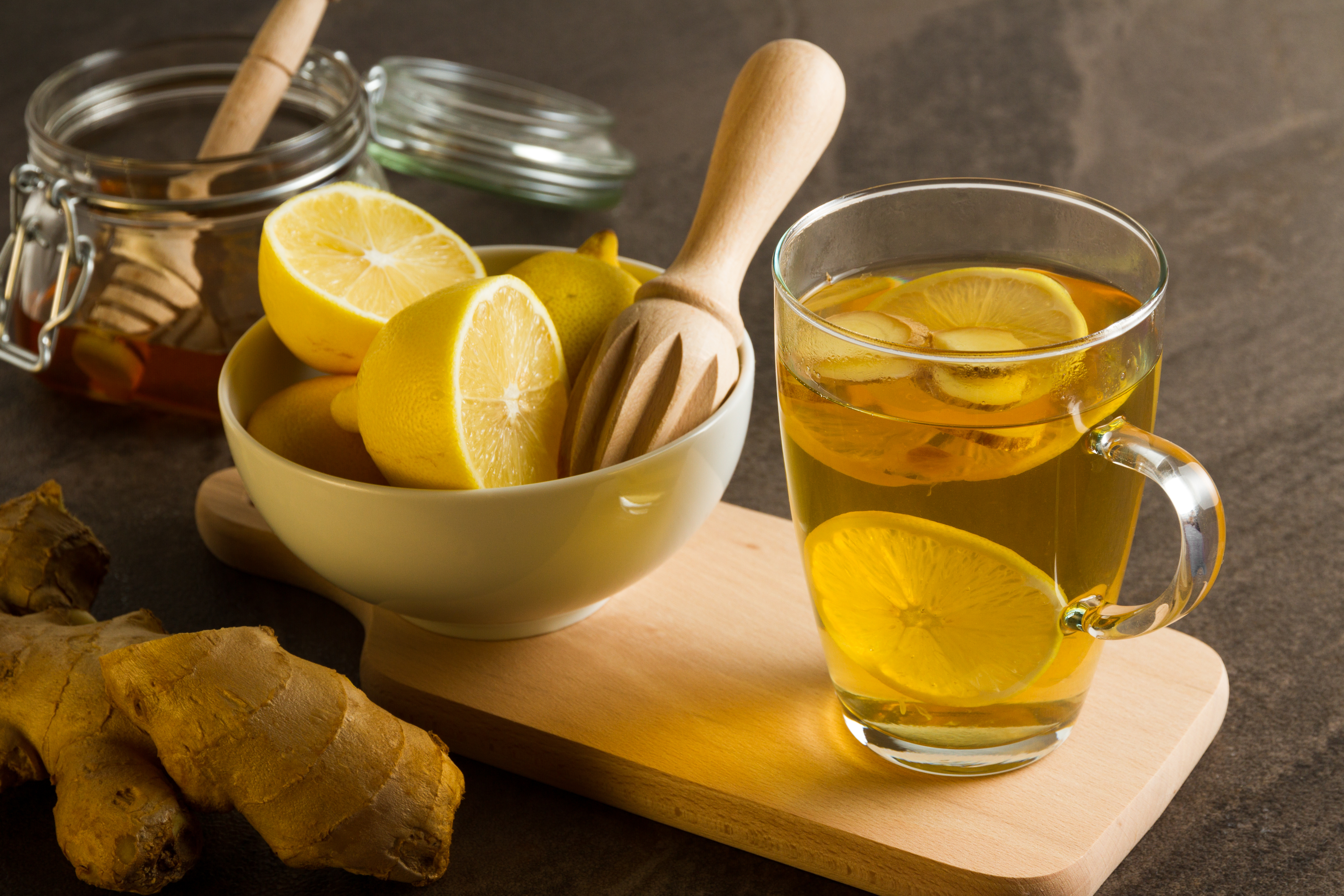 Fresh lemons, ginger and a glass of tea