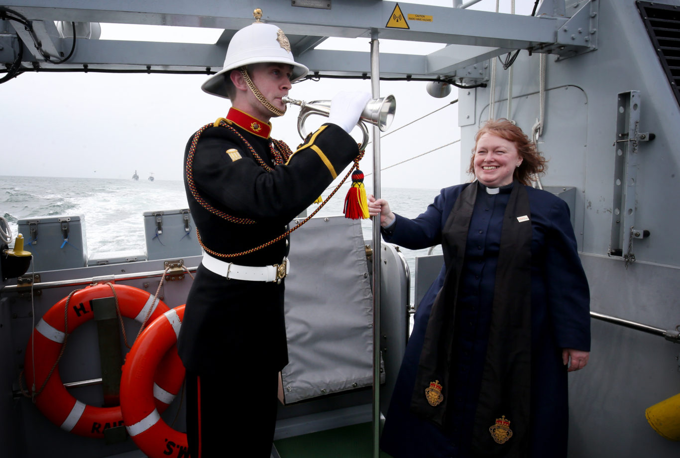 Royal Marines bugler Steven Booth and Reverend Dr Karen Campbell, on board HMS Raider (Jane Barlow/PA)