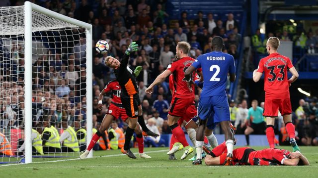 Jonas Lossl pulls off a stunning save to earn his side a point at Chelsea that keeps Town in the Premier League