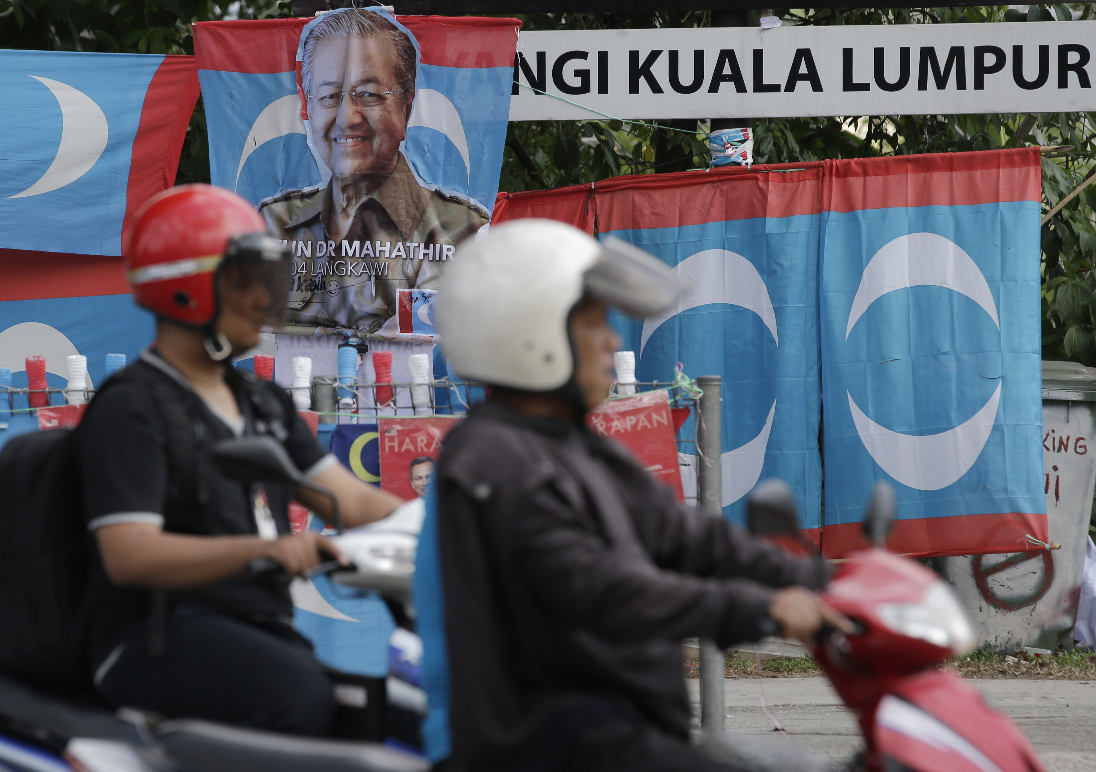 A campaign poster of Mahathir Mohamad is displayed on a street in Kuala Lumpur (Aaron Favila/AP)