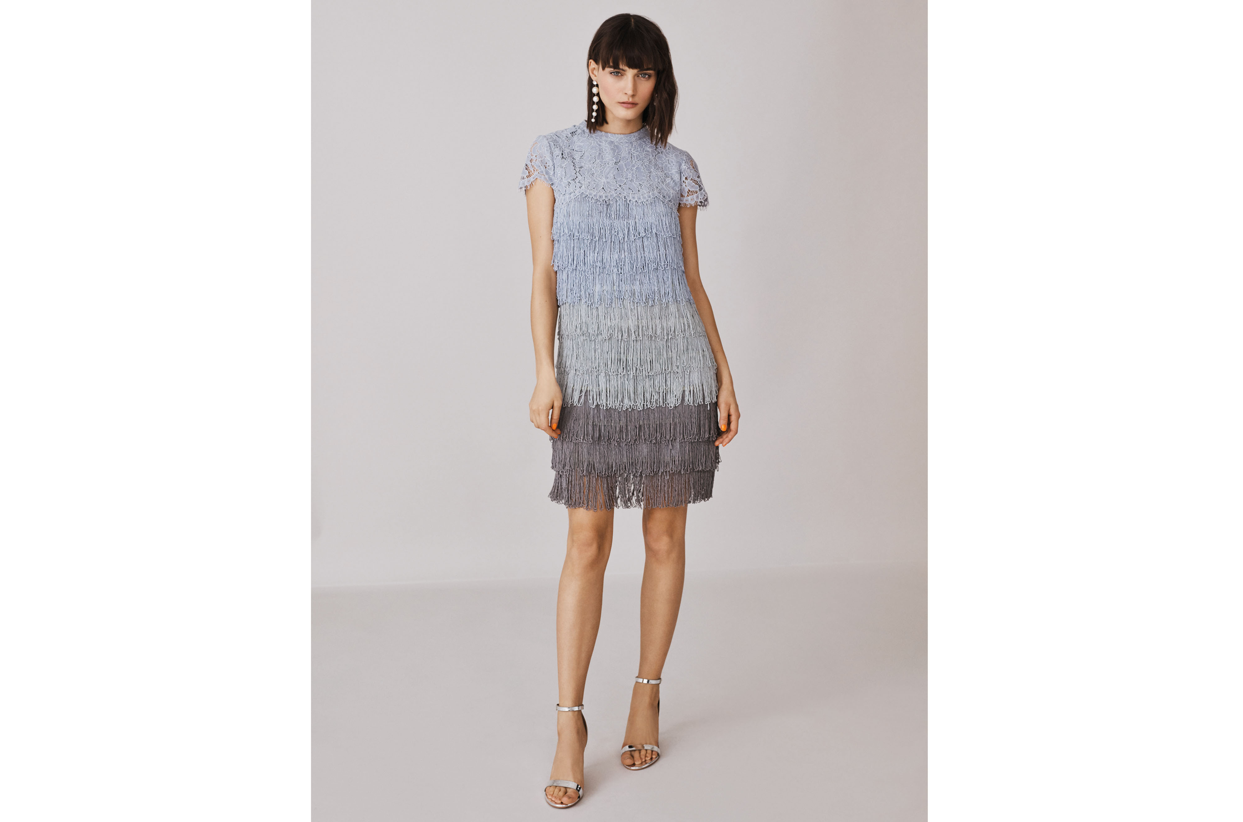 model wearing Oasis Fringe Dress and Suki Silver Strap Heels