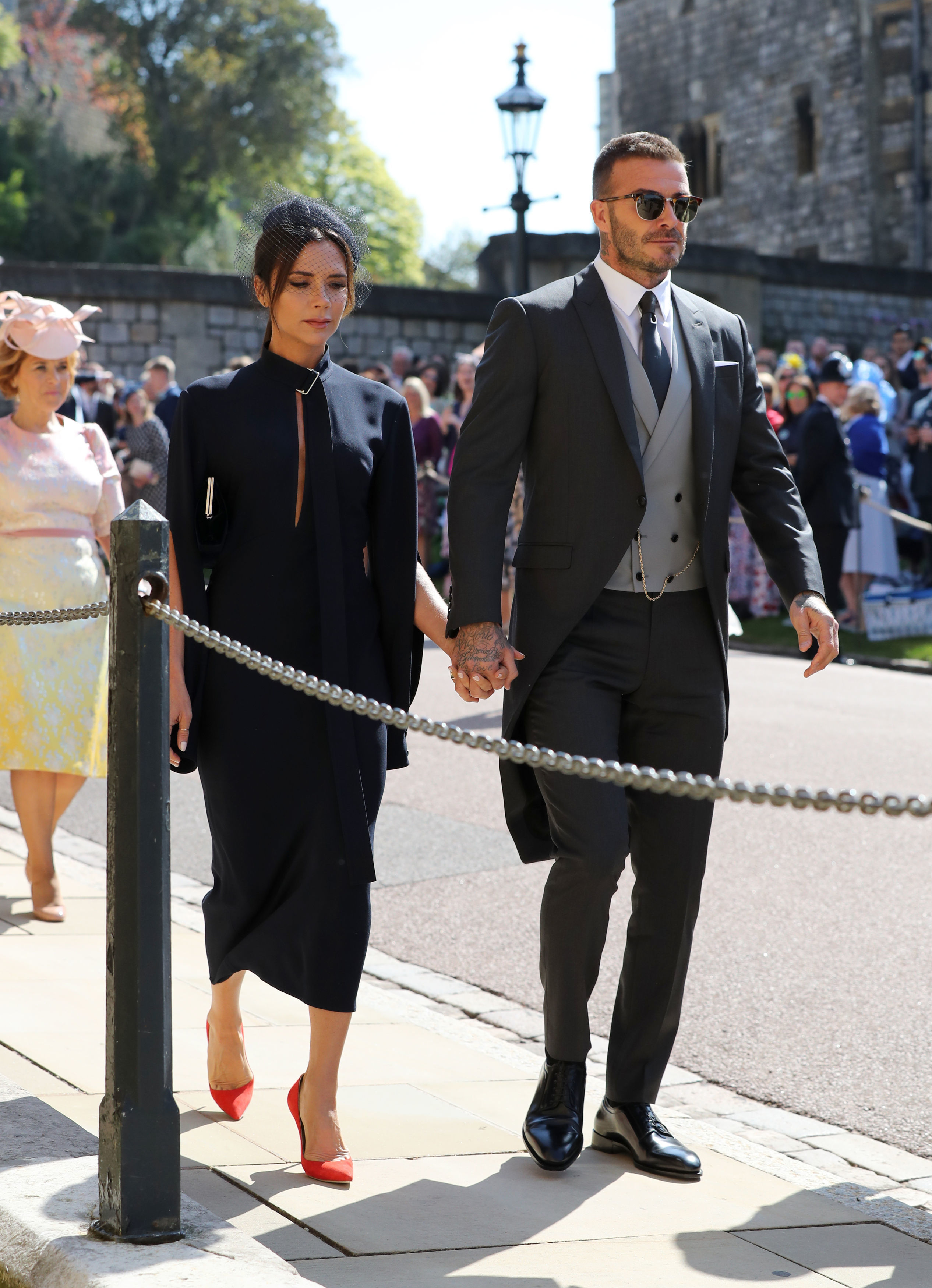 Victoria Beckham opted for a more sombre tone as she joined husband David (Gareth Fuller/PA)