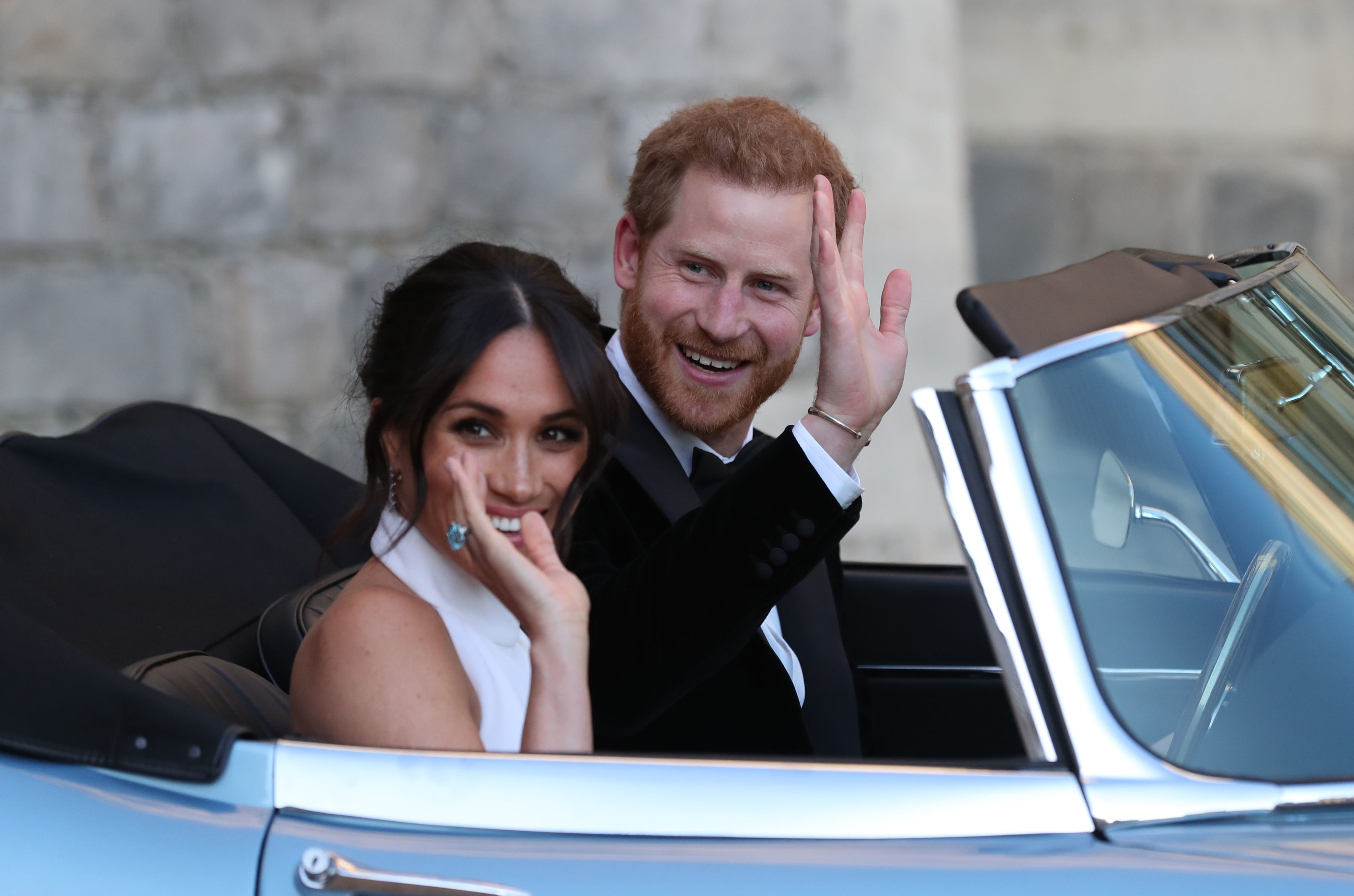 The newly married Duke and Duchess of Sussex, Meghan Markle and Prince Harry, leaving Windsor Castle after their wedding to attend an evening reception at Frogmore House, hosted by the Prince of Wales. (Steve Parsons/PA)