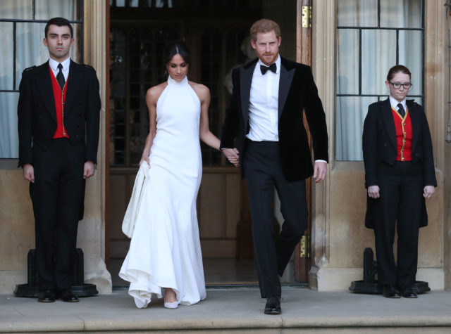 The newly married Duke and Duchess of Sussex, Meghan Markle and Prince Harry leave Windsor Castle to attend an evening reception at Frogmore House (Steve Parsons/PA)