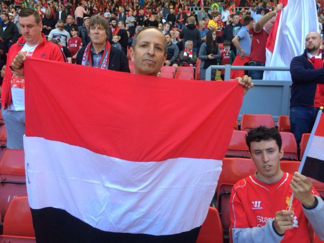 Chair of the Liverpool Arabic Centre Razak Mossa (left) and Haitham Mossa display their support for Mohamed Salah on the Kop at Anfield.