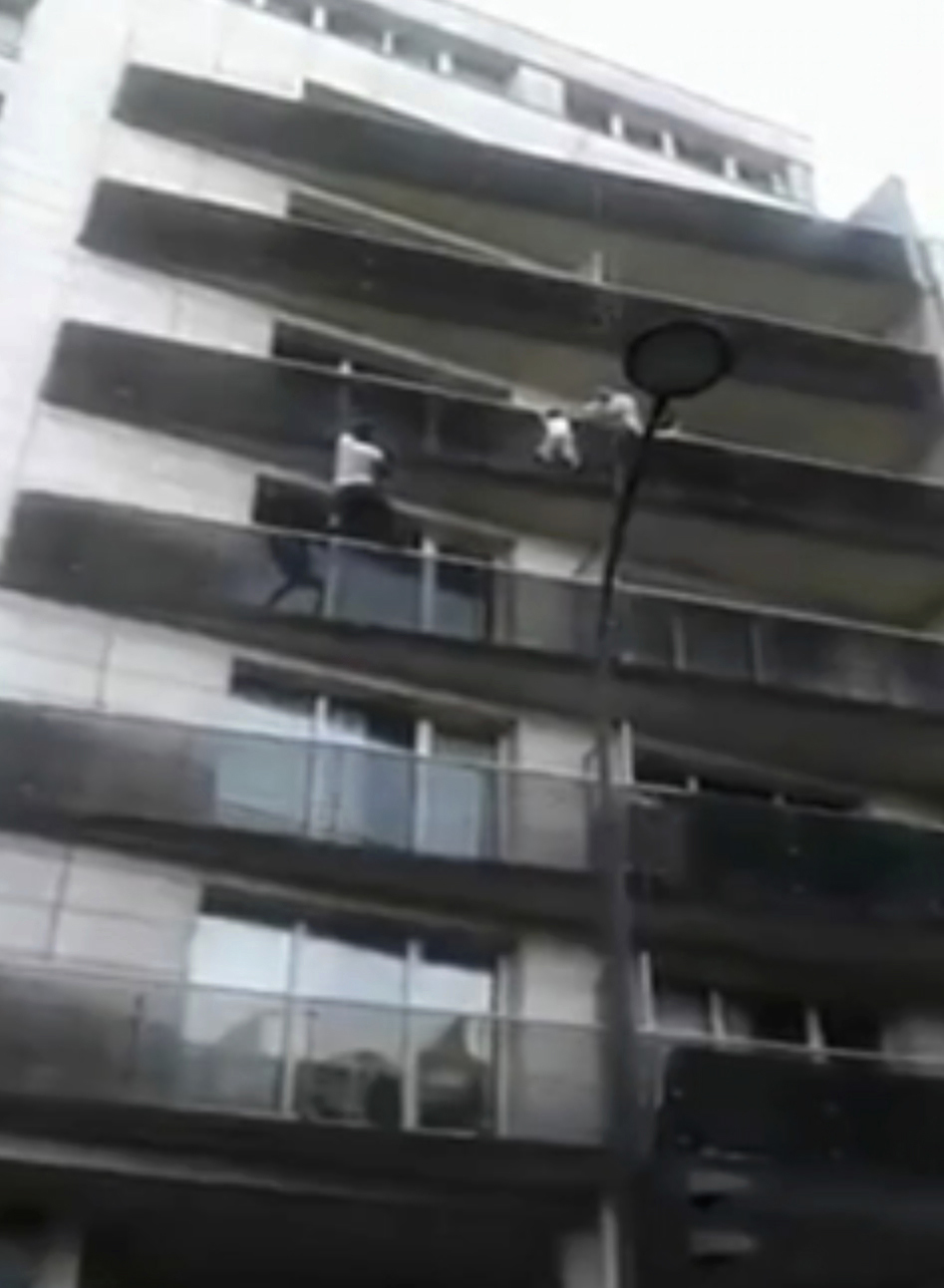 Mamoudou Gassama scales an apartment building to save a young child (AP)