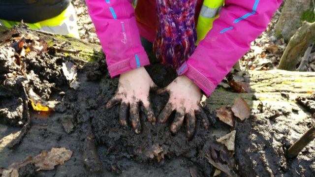 Child playing with mud