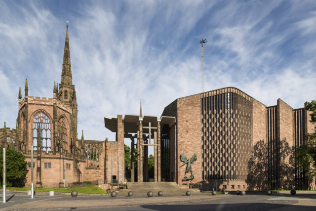 Coventry Cathedral was built next to the ruin of the old cathedral, destroyed in a bombing raid (Historic England/PA)