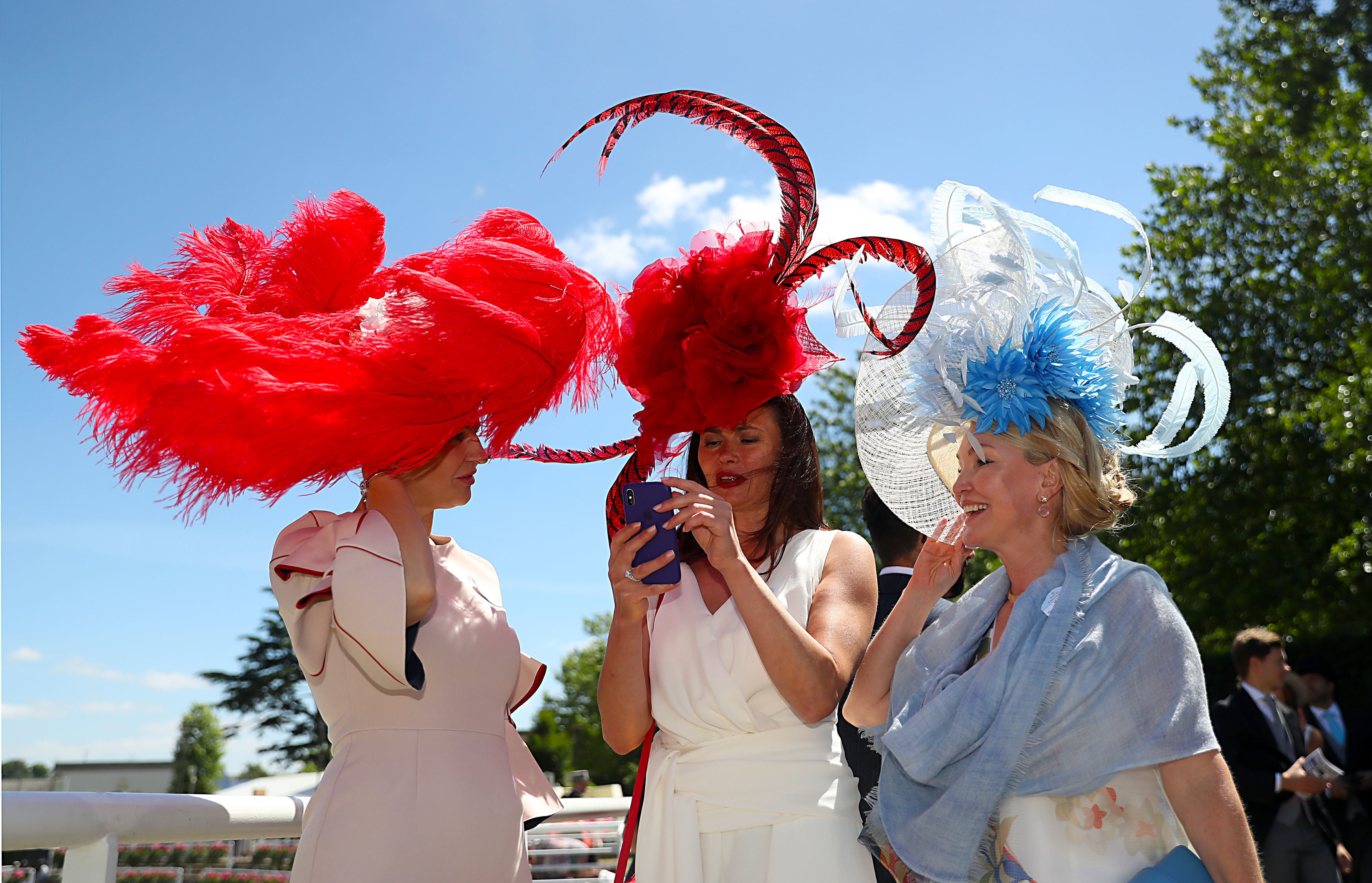 Racegoers wearing large hats during day three of Royal Ascot