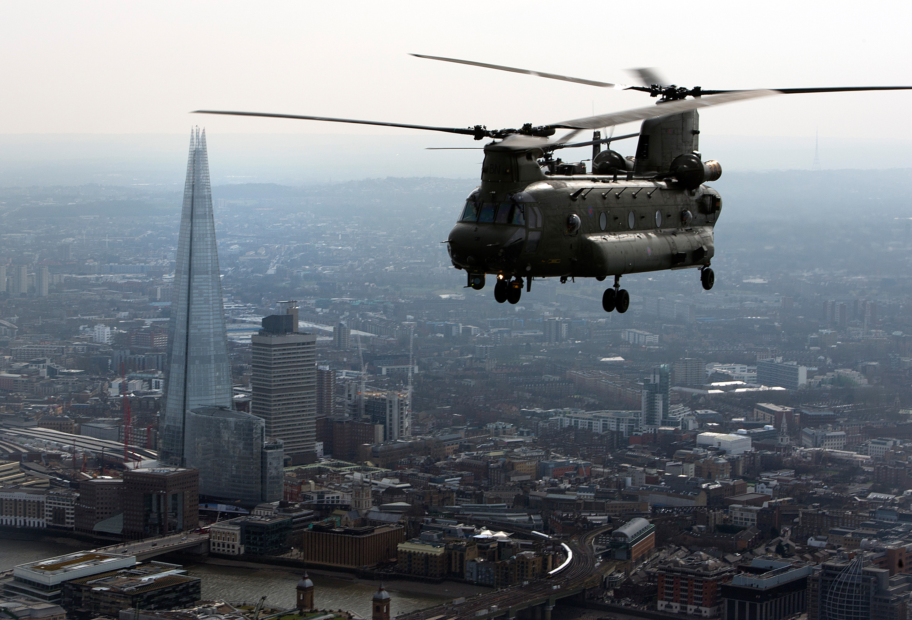 An RAF Chinook flies over central London