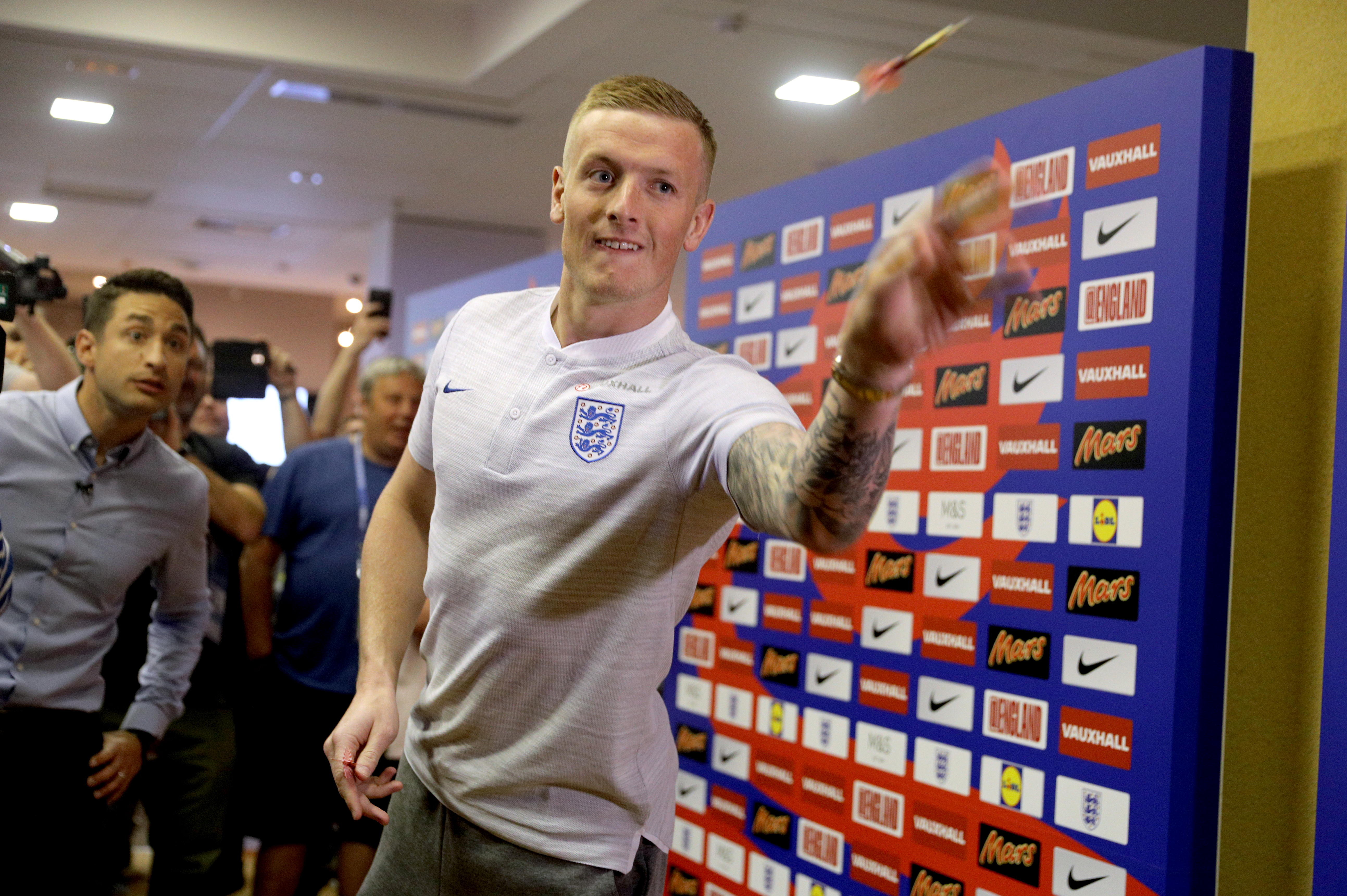 England's Jordan Pickford plays darts during a press conference