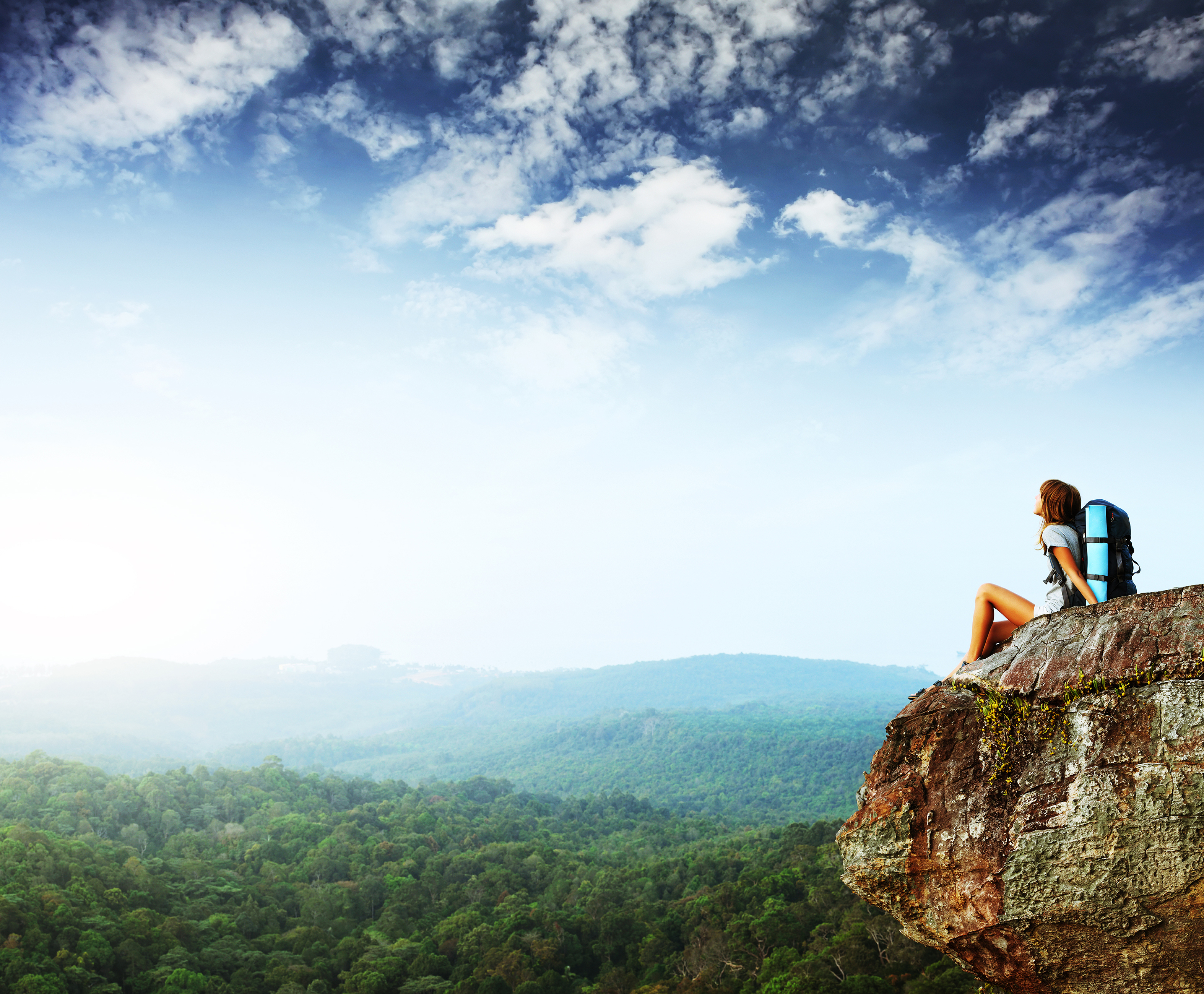 A female backpacker on a mountain