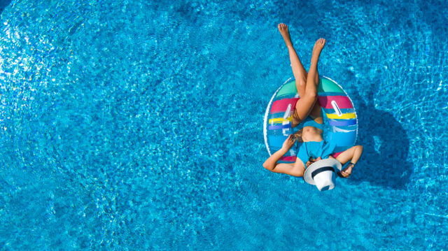 Aerial view of girl in swimming pool