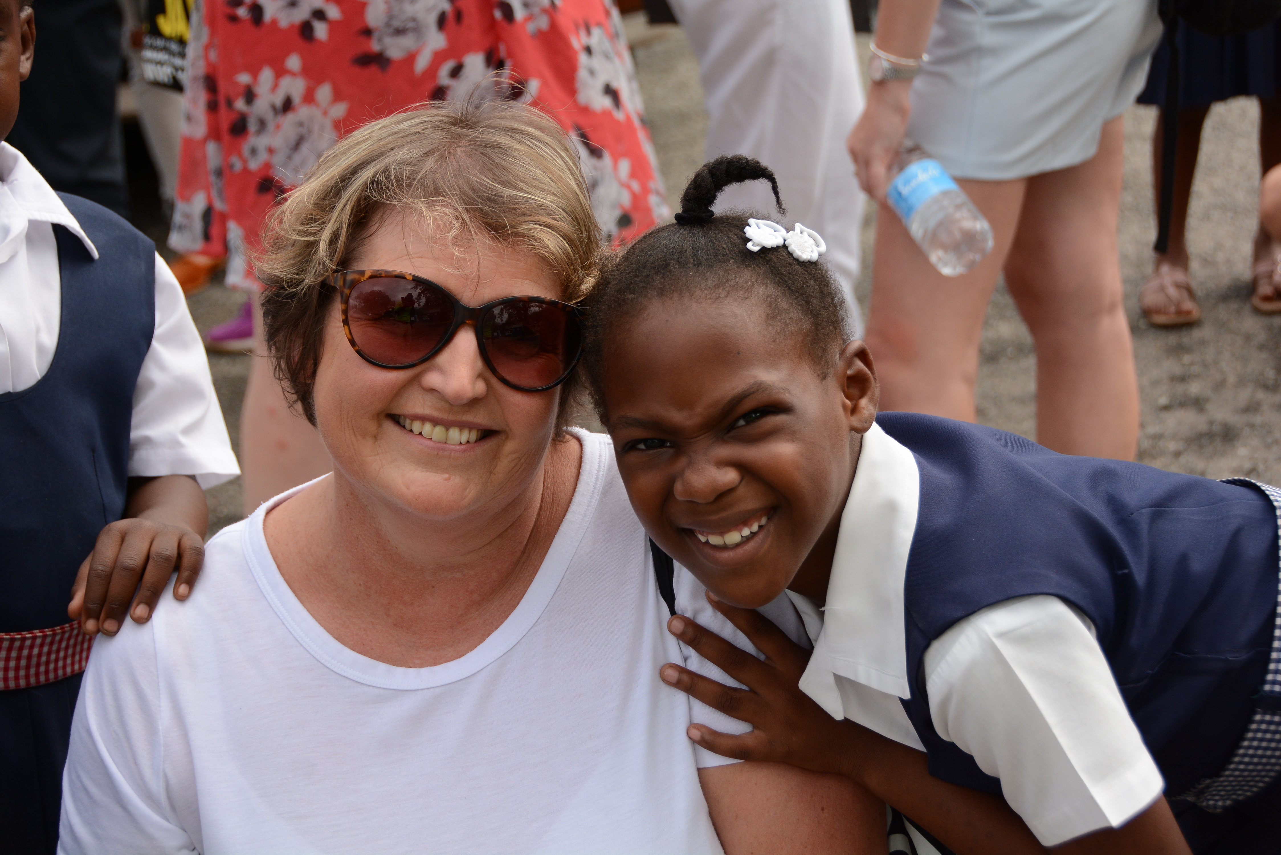 Hannah with a pupil from Ocho Rios Primary School (Sandals Resorts/PA)