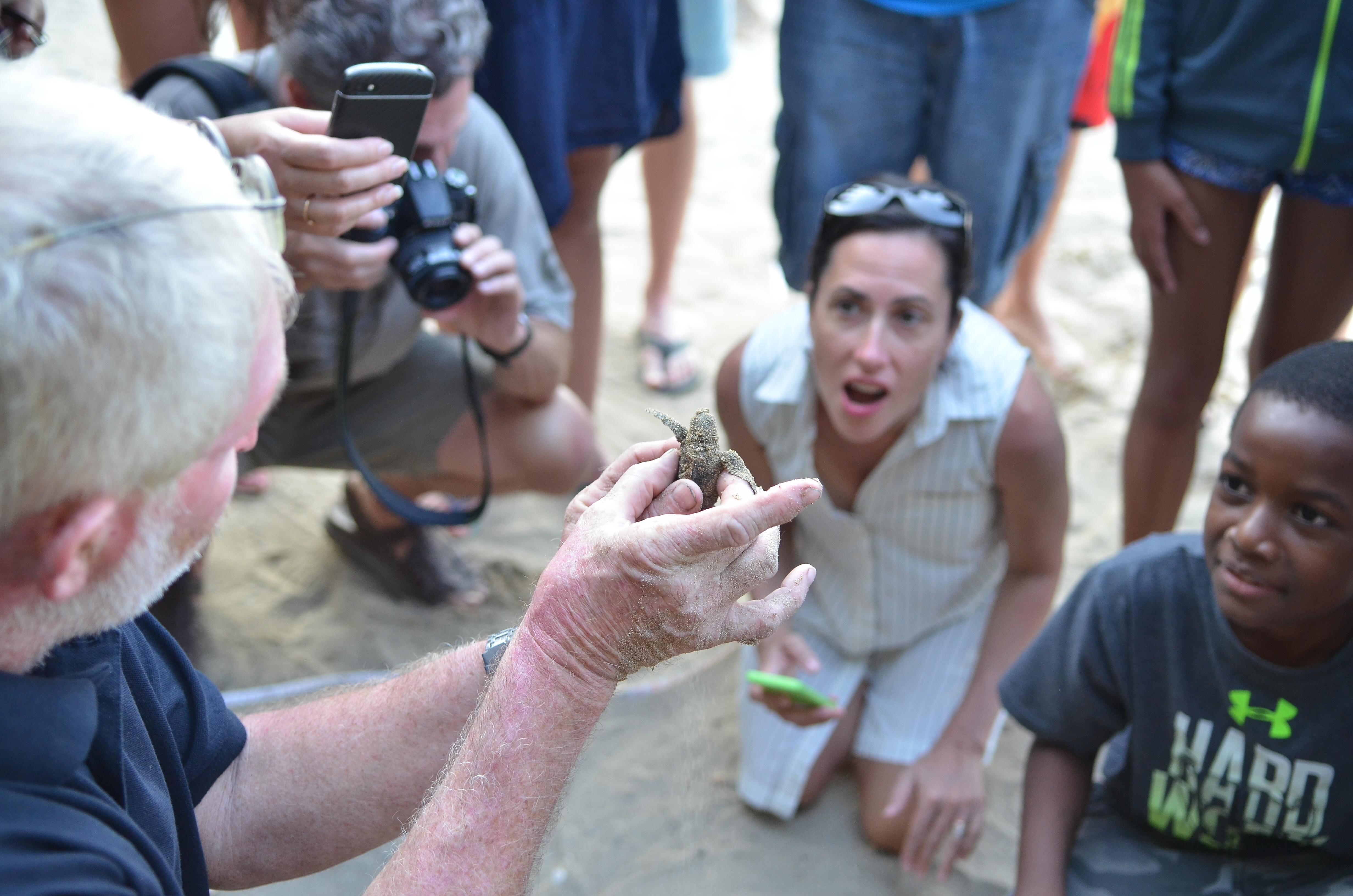 Melvyn Tennant with a baby turtle (Melvyn Tennant/PA)
