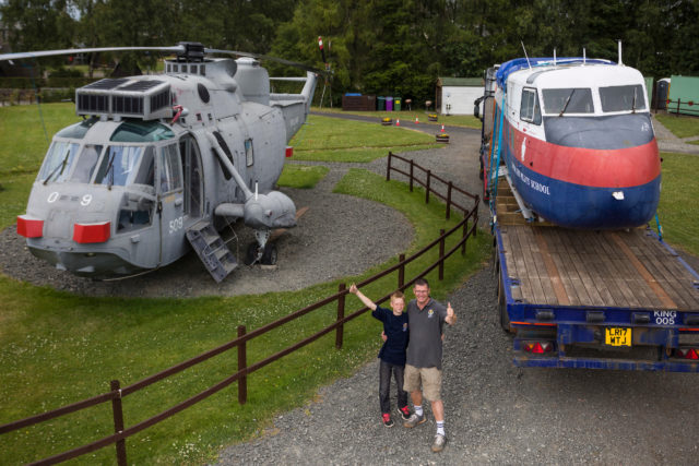 Martyn Steedman and son Harry with the Twin Pioneer and the Sea King already converted into accommodation (Craig Stephen/PA)