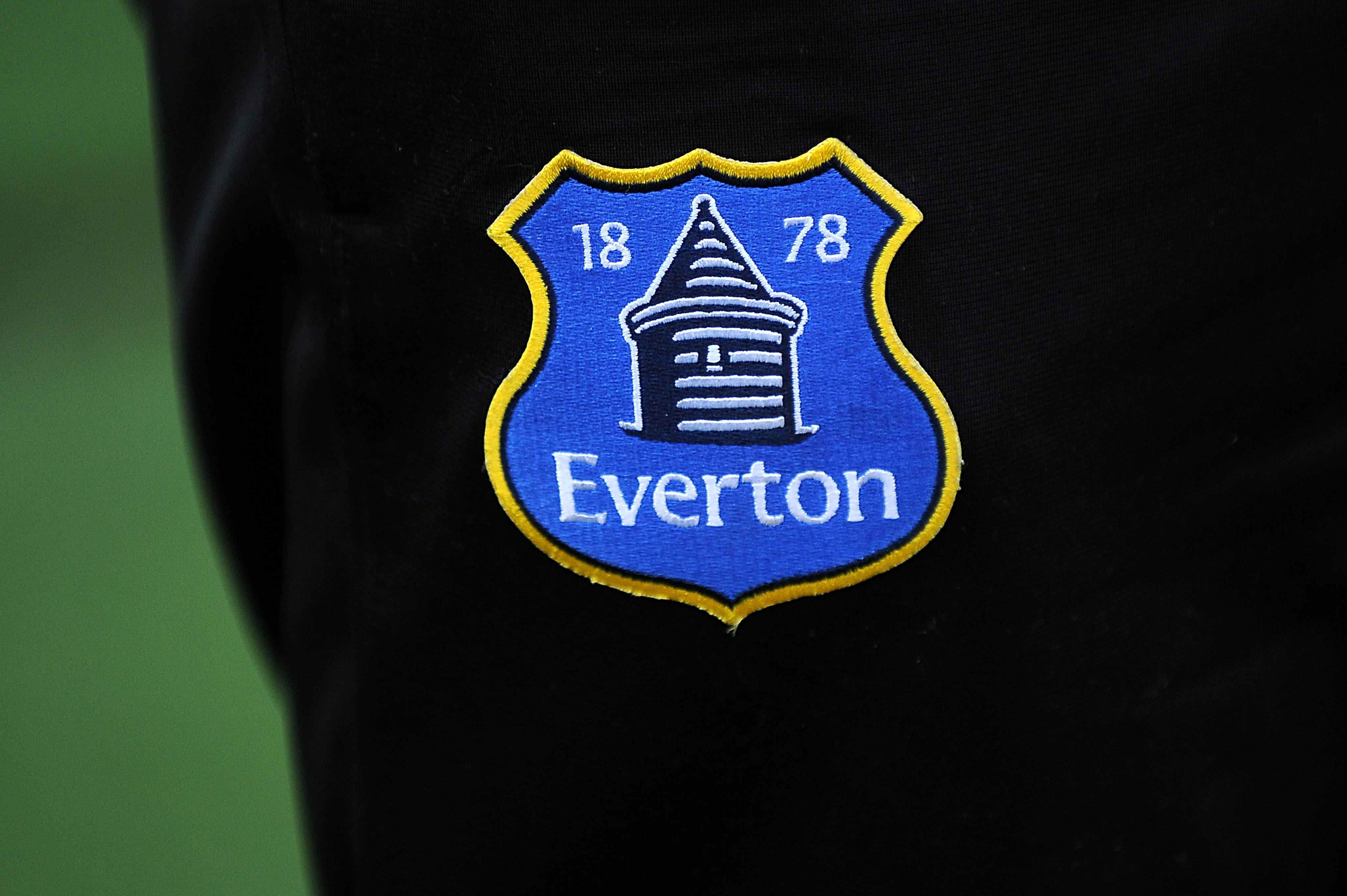 An Everton badge on the shorts of a player
