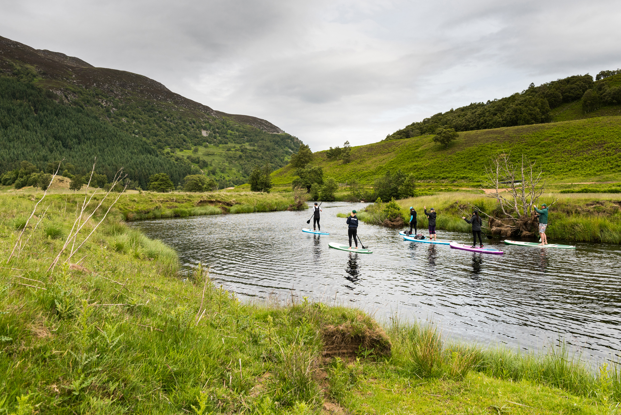 Journalist Abi Jackson and fellow group members on a guided SUP trip in Cairngorms National Park, Scotland, with Red Paddle Co and Daffy's Gin (Ed Smith Photography/PA)