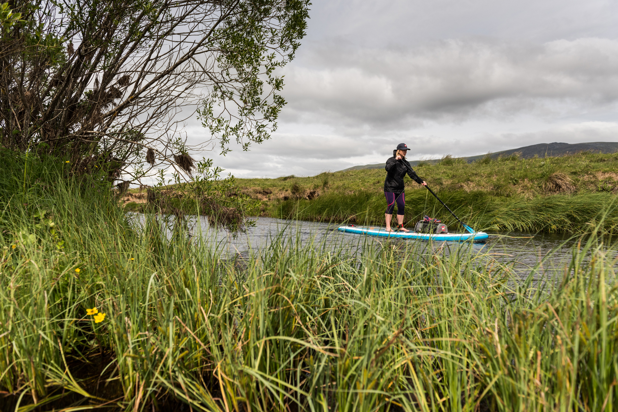 journalist Abi Jackson on a guided SUP trip in Cairngorms National Park, Scotland, with Red Paddle Co and Daffy's Gin (Ed Smith Photography/PA)