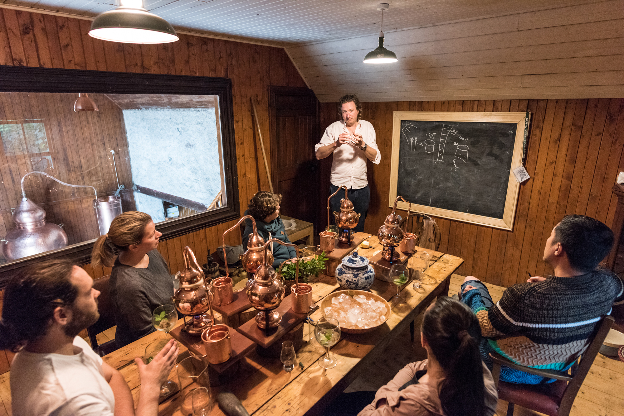 journalist Abi Jackson during a gin making session with Chris Molyneaux, Daffy's Gin managing director, at Strathmashie Distillery, Scotland (Ed Smith Photography/PA)