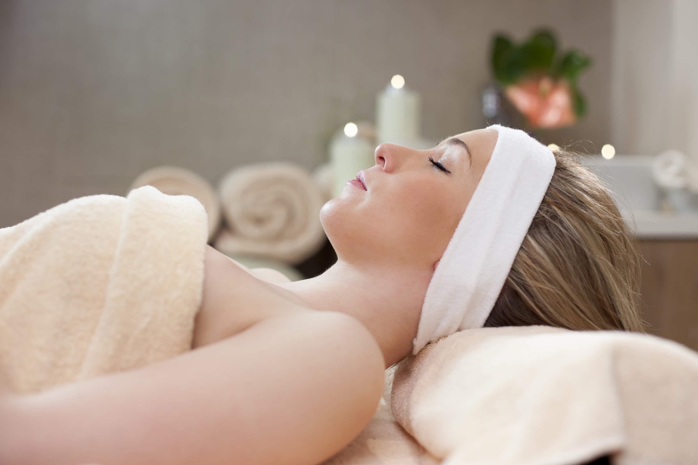 woman lying on a bed in a spa