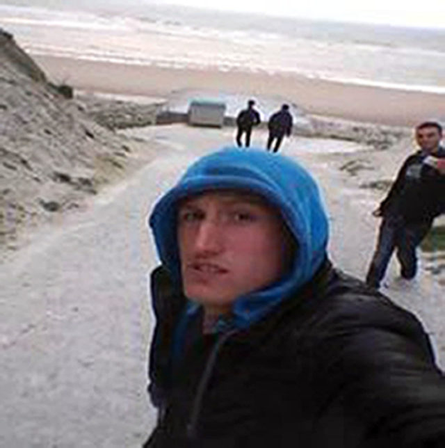 Migrants were pictured on the beach.