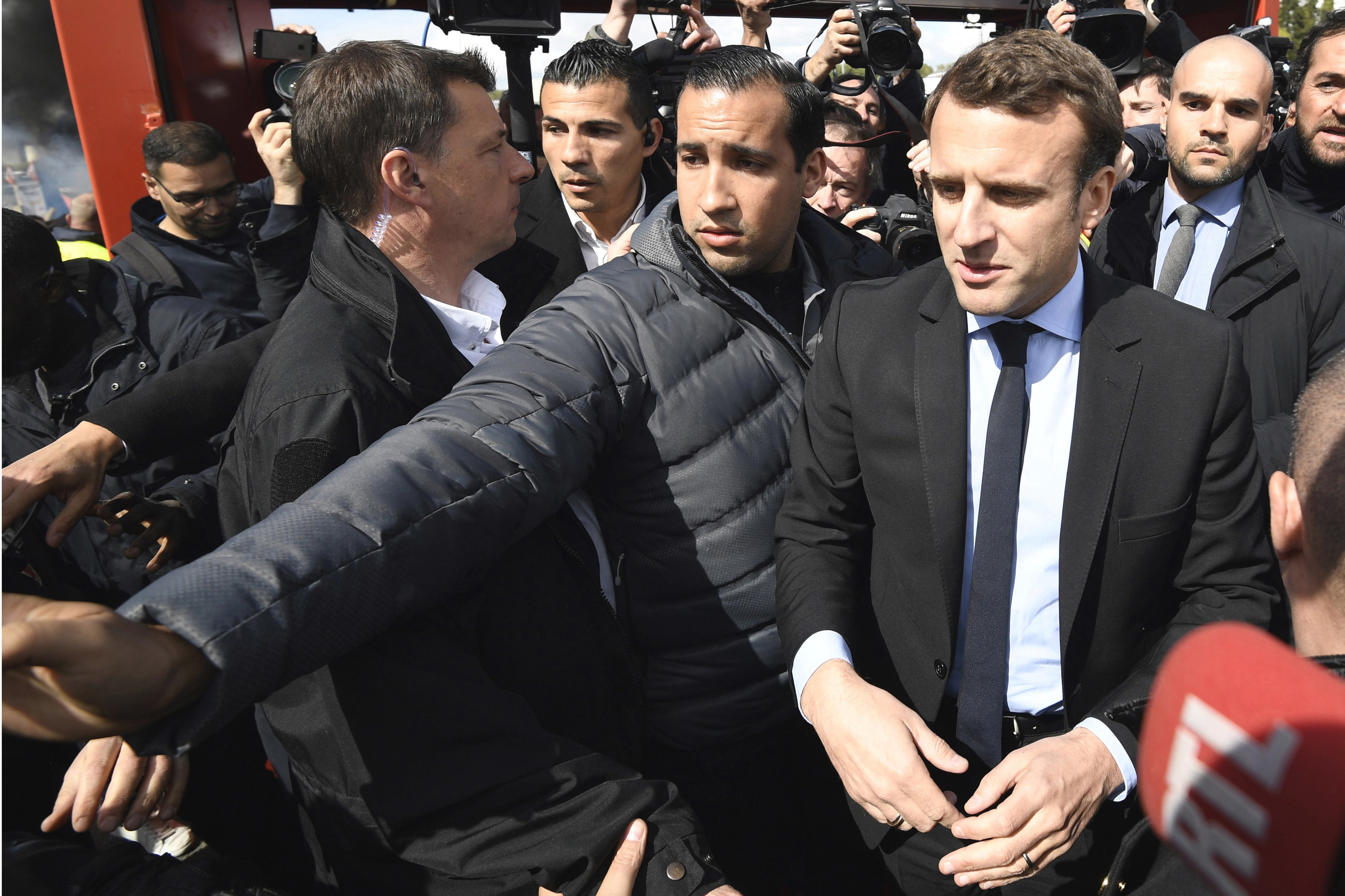 Emmanuel Macron flanked by Alexandre Benalla
