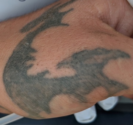 The dragon-like tattoo