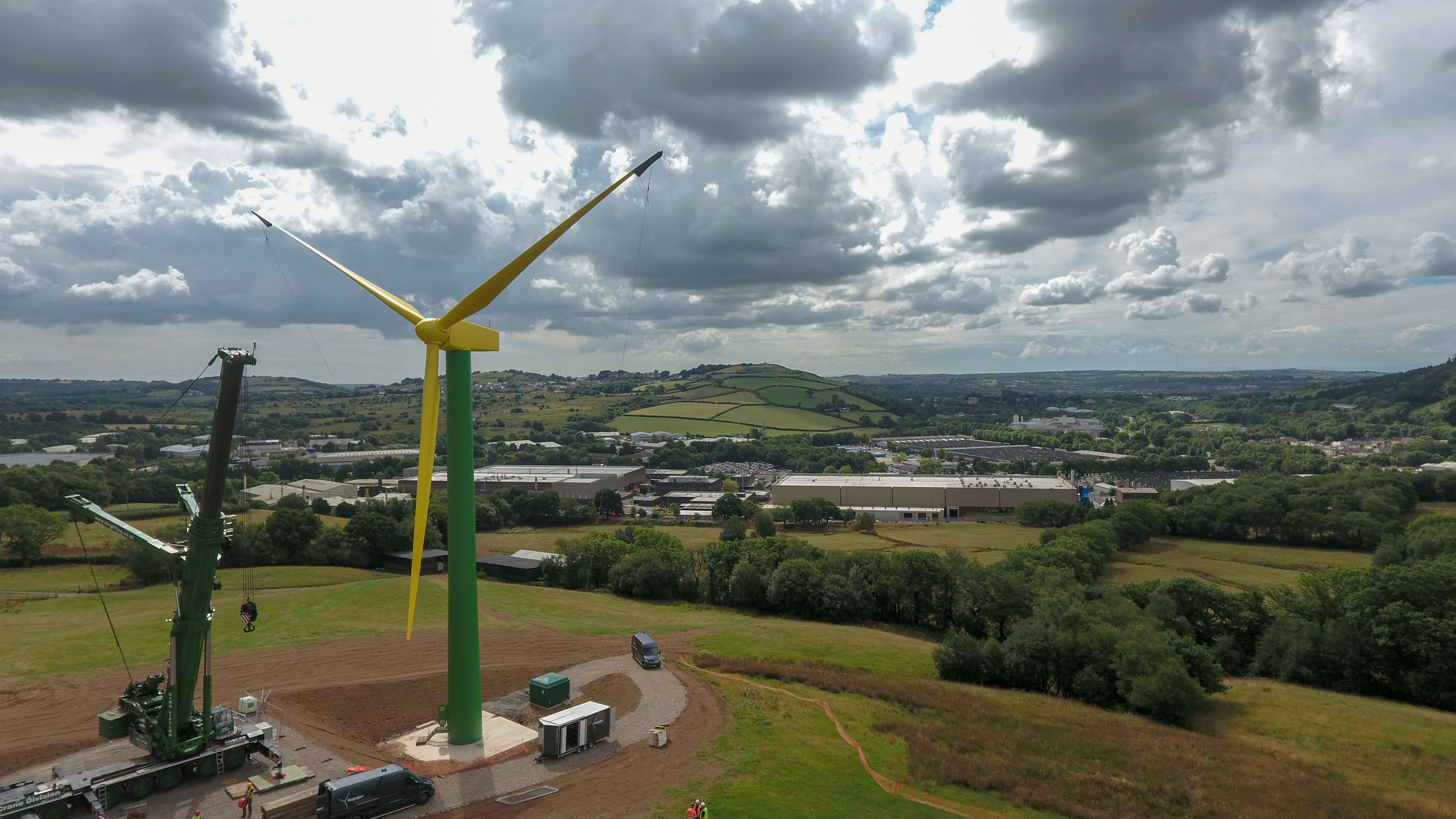 The "daffodil" wind turbine on hills behind the Royal Mint in Llantrisant